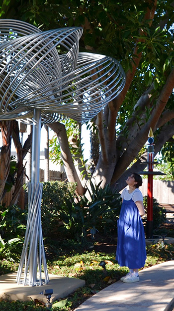 Woman and sculpture in Carlsbad Sculpture Garden