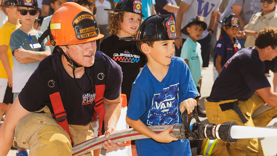 Fire hose demonstration with kids