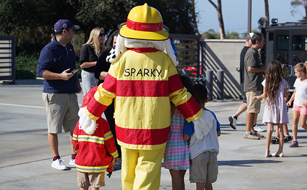 Sparky with kids at Public Safety Open House